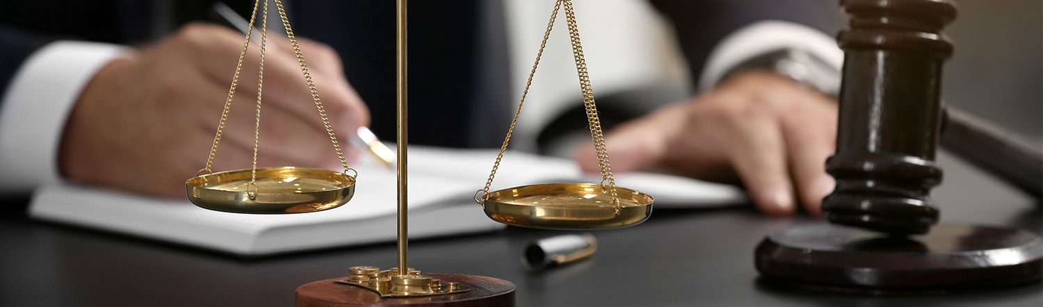 close up of gavel on attorney desk.