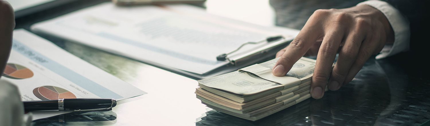 close-up of stack of money in hand