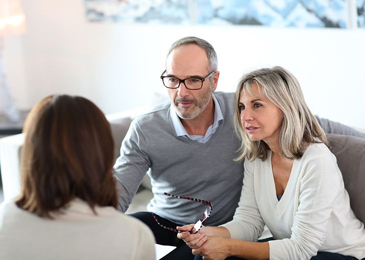 close-up of senior couple having a meeting about estate planning