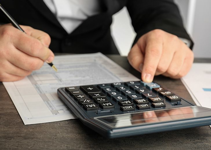 business man using calculator