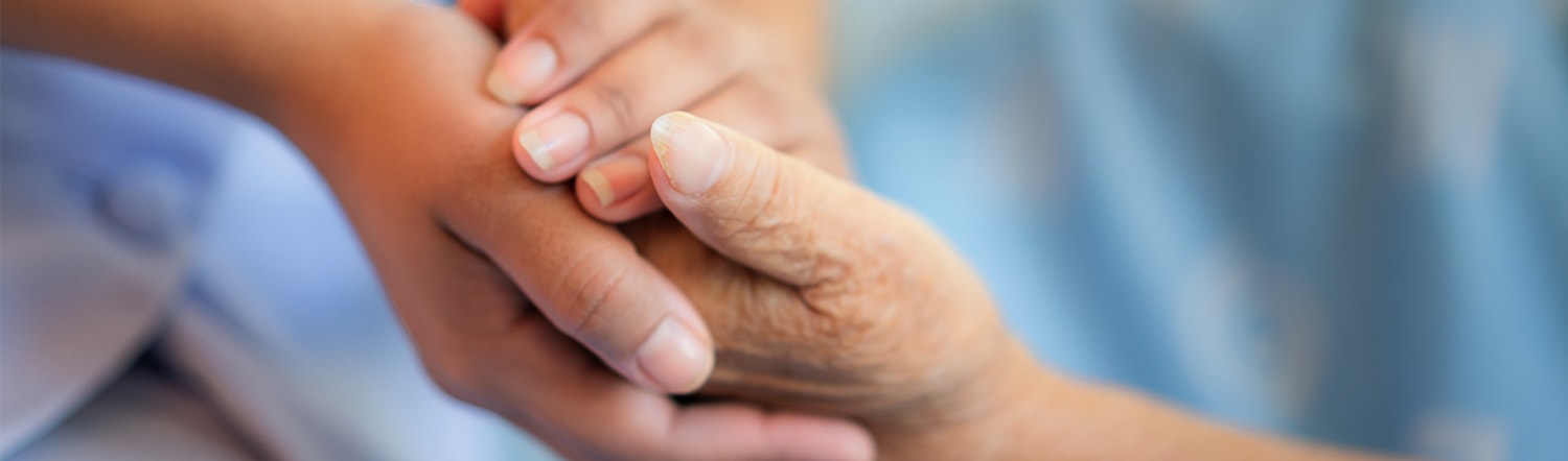 holding hands with elderly woman