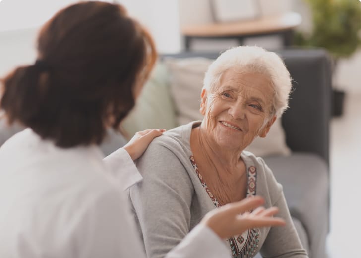 woman and elderly woman having a conversation