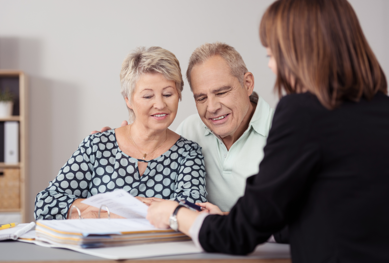 couple talking to real estate agent