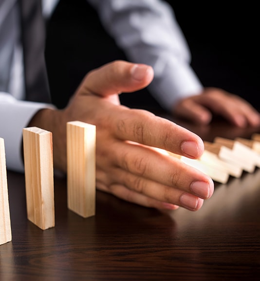 gentleman knocking blocks over with his hand