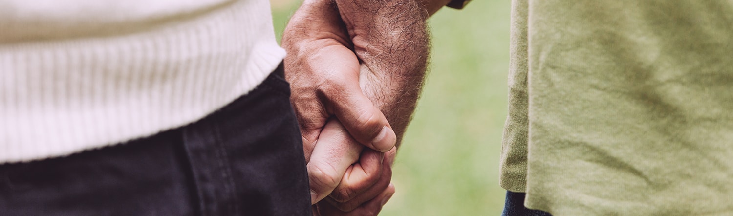 married couple holding hands