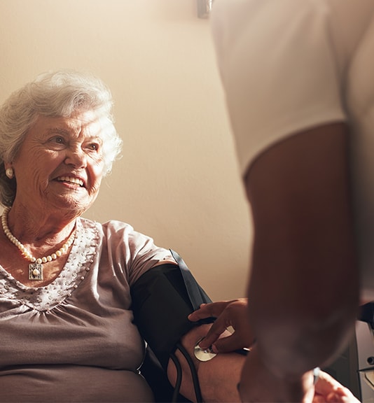 woman getting her blood pressure taken