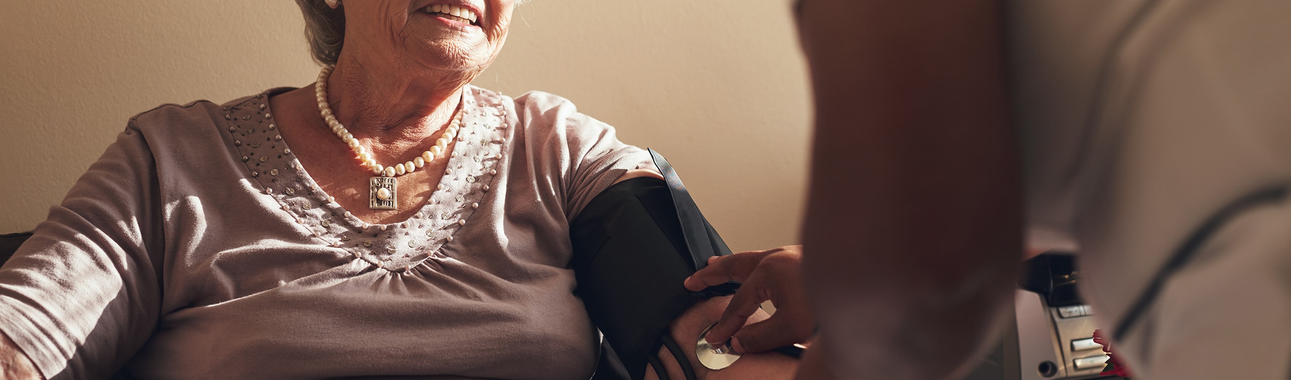 close-up of woman getting her blood pressure taken