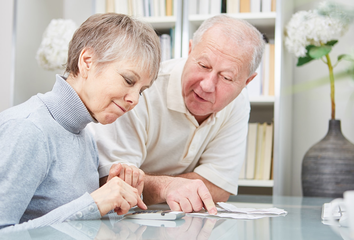 elderly couple looking over information