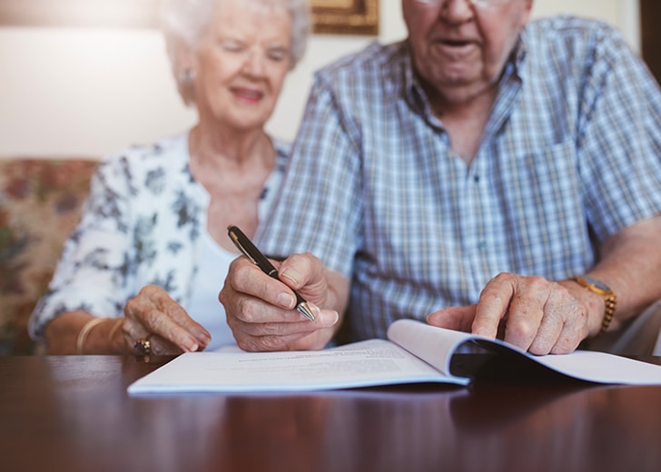 elderly couple writing will