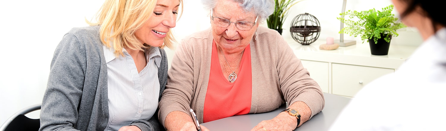 close up of elderly woman writing trust