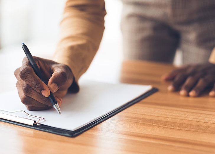 man signing estate plan