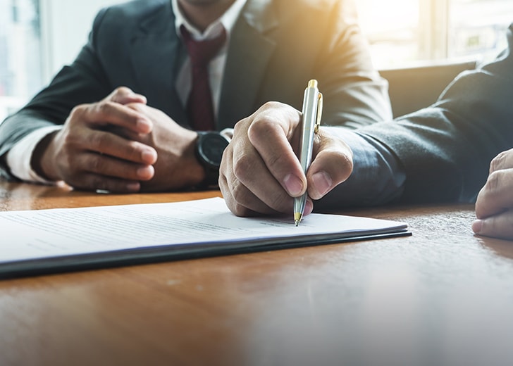 man signing estate plan