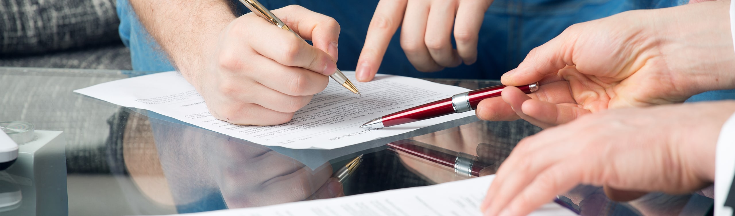 close up of man signing power of attorney document