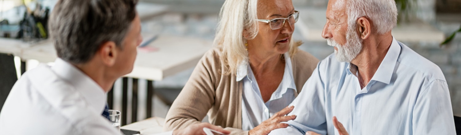 elderly couple discussing estate planning