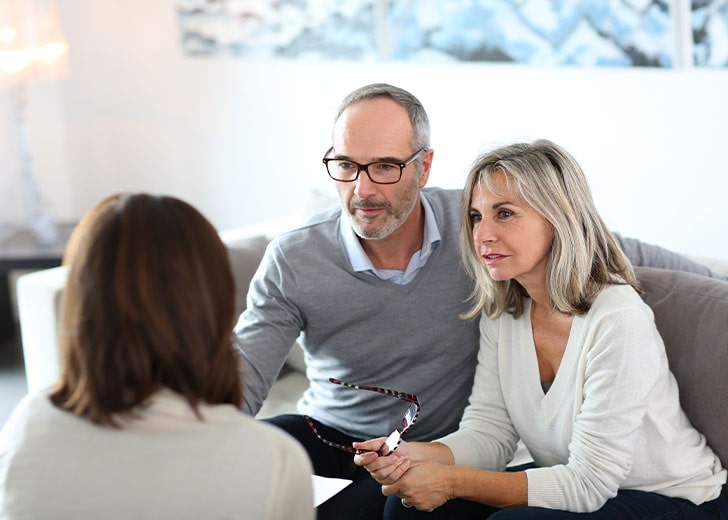 senior couple meets with lawyer to go over why estate planning is important